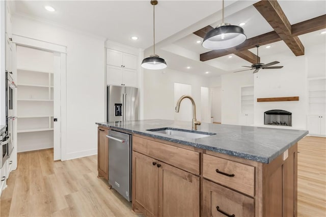 1701 Kerr Valley Ln, College Station, TX 77845 - kitchen with ceiling fan, stainless steel appliances, light wood-type flooring, a kitchen island with sink, and coffered ceiling