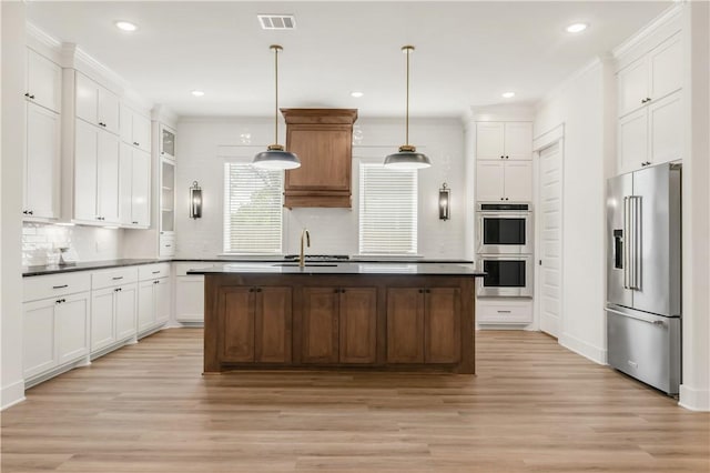 1701 Kerr Valley Ln, College Station, TX 77845 - kitchen with appliances with stainless steel finishes, light wood-style floors, tasteful backsplash, white cabinets, and recessed lighting