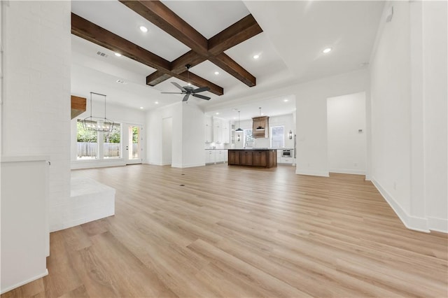 1701 Kerr Valley Ln, College Station, TX 77845 - unfurnished living room featuring ceiling fan, beamed ceiling, light wood-style flooring, a chandelier, and coffered ceiling