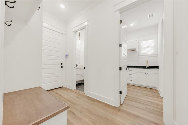 1701 Kerr Valley Ln, College Station, TX 77845 - corridor with light wood-style floors, crown molding, and recessed lighting