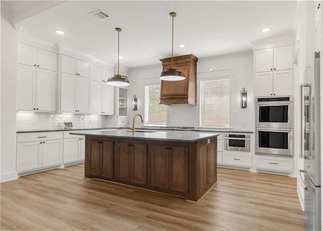 1701 Kerr Valley Ln, College Station, TX 77845 - kitchen with appliances with stainless steel finishes, decorative backsplash, light wood-style floors, recessed lighting, and dark countertops