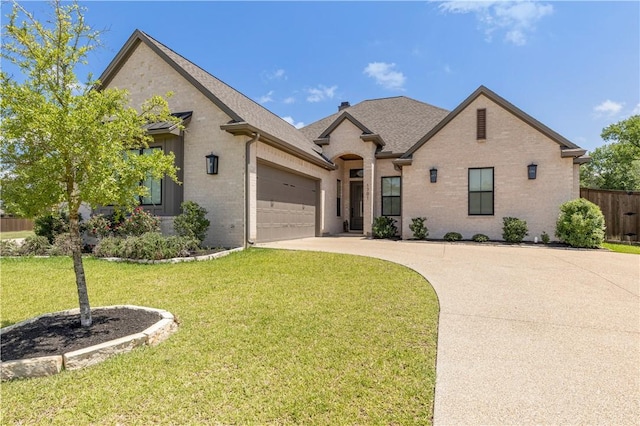 1701 Kerr Valley Ln, College Station, TX 77845 - french provincial home featuring brick siding, a garage, driveway, and a shingled roof