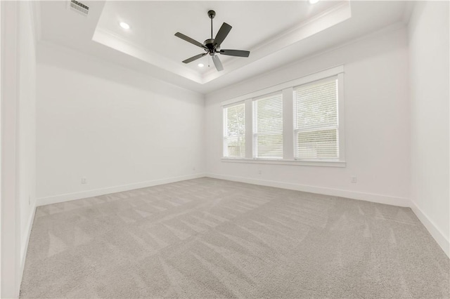 1701 Kerr Valley Ln, College Station, TX 77845 - carpeted spare room featuring a tray ceiling, recessed lighting, a ceiling fan, and crown molding