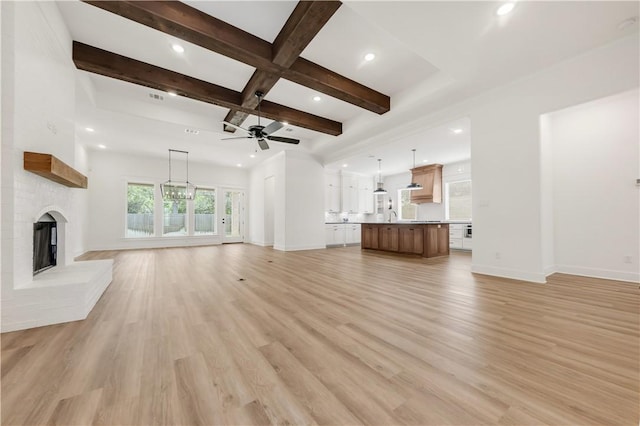 1701 Kerr Valley Ln, College Station, TX 77845 - unfurnished living room featuring a brick fireplace, beamed ceiling, ceiling fan, light wood-style flooring, and coffered ceiling