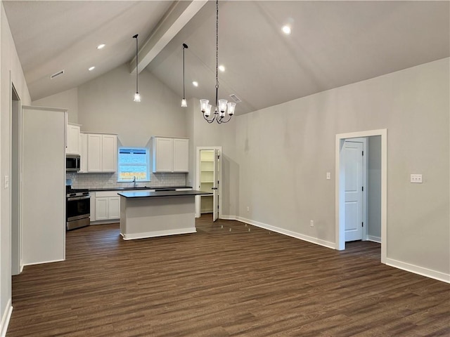 kitchen featuring white cabinets, dark hardwood / wood-style floors, a center island, and stainless steel appliances