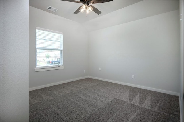 carpeted empty room featuring ceiling fan, baseboards, lofted ceiling, and visible vents