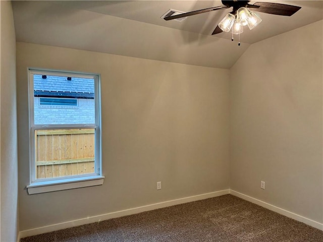 unfurnished room with ceiling fan, carpet, and vaulted ceiling