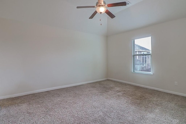 unfurnished room featuring vaulted ceiling, ceiling fan, and carpet floors