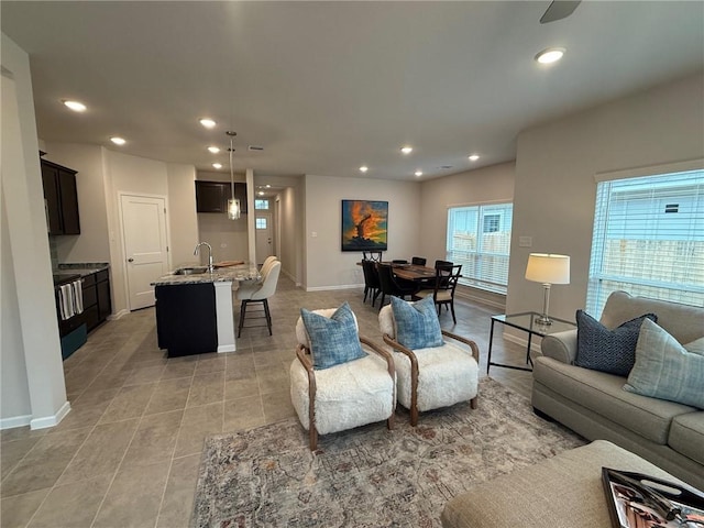 tiled living room featuring sink