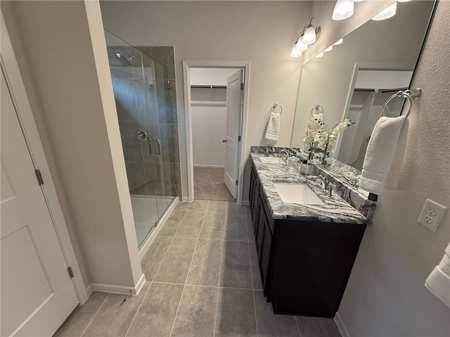 bathroom with vanity and an enclosed shower