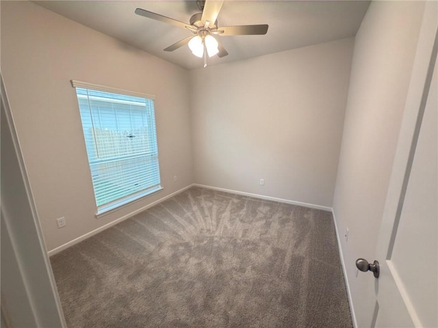 empty room featuring carpet floors and ceiling fan