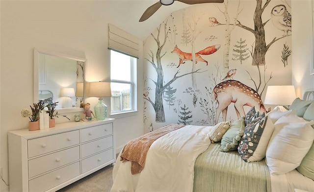 bedroom with ceiling fan and light colored carpet