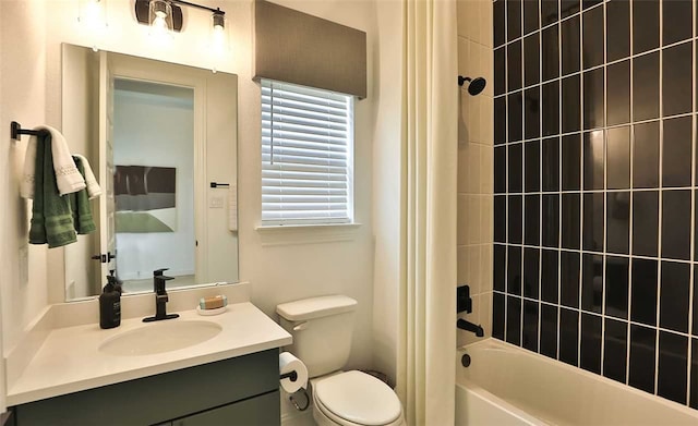 bathroom featuring toilet, shower / bath combination with curtain, and vanity