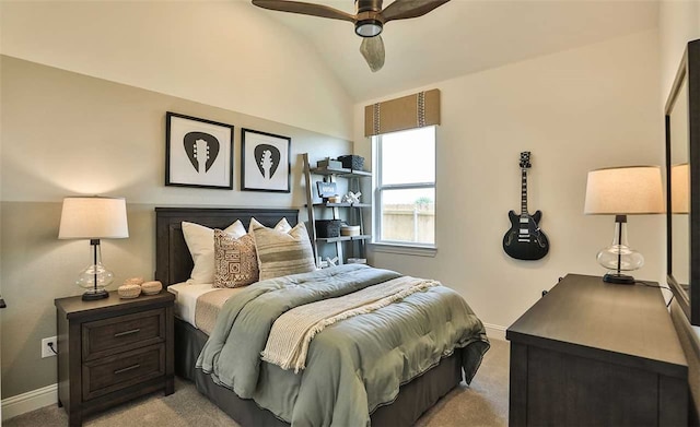 bedroom featuring vaulted ceiling, baseboards, a ceiling fan, and light colored carpet