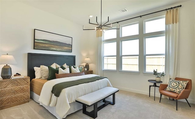 bedroom with visible vents, baseboards, a notable chandelier, and light colored carpet