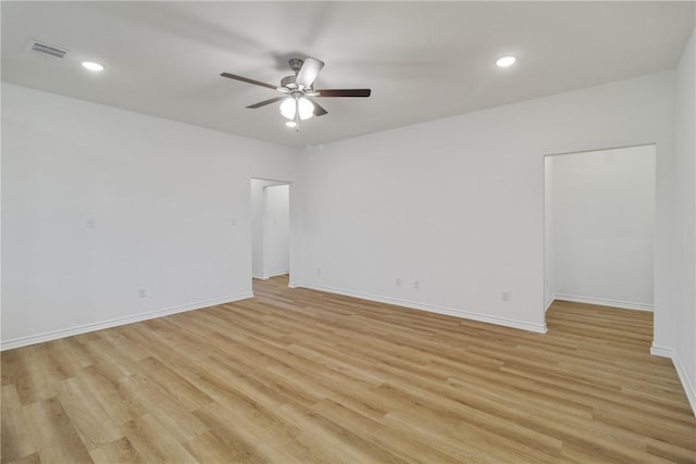 spare room with ceiling fan and light hardwood / wood-style floors