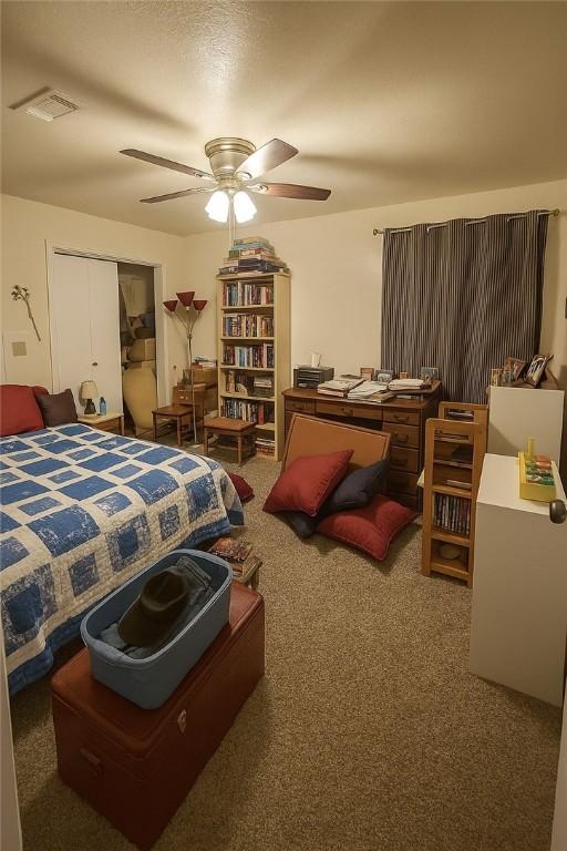 2106 Labrisa Dr, Bryan, TX 77807 - carpeted bedroom with a closet and a ceiling fan