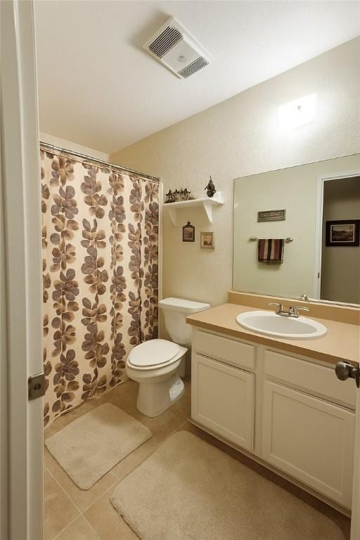 2106 Labrisa Dr, Bryan, TX 77807 - bathroom with vanity, tile patterned flooring, and curtained shower