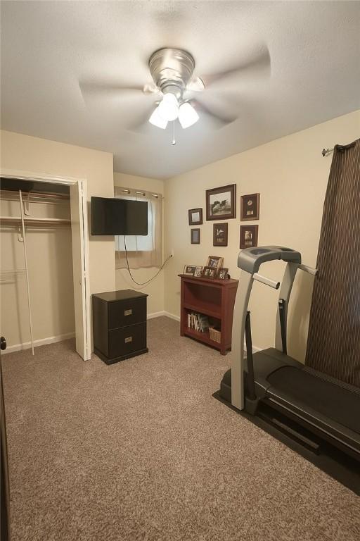2106 Labrisa Dr, Bryan, TX 77807 - workout area featuring carpet flooring and ceiling fan