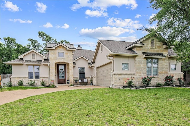 craftsman-style home featuring metal roof, an attached garage, driveway, a front lawn, and a standing seam roof