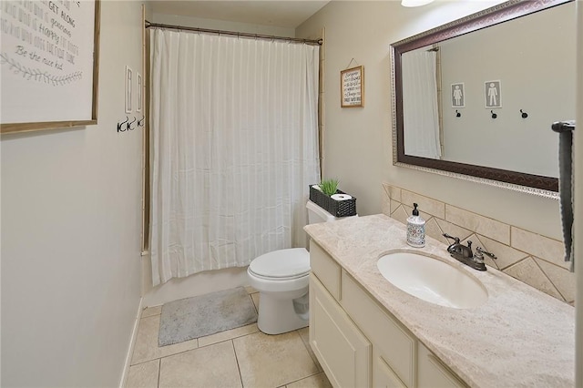 full bathroom with shower / bath combination with curtain, tile patterned flooring, vanity, and toilet