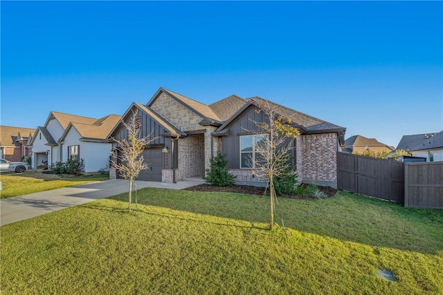 view of front of property featuring a front yard and a garage