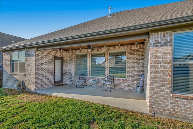 back of property with a patio and ceiling fan