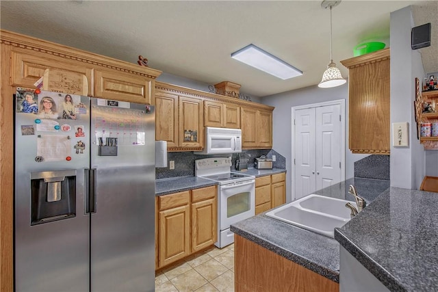 801 Camellia Ct, College Station, TX 77840 - kitchen with white appliances, a sink, dark countertops, tasteful backsplash, and decorative light fixtures