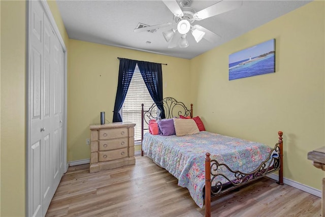 801 Camellia Ct, College Station, TX 77840 - bedroom with a closet, wood finished floors, baseboards, and ceiling fan