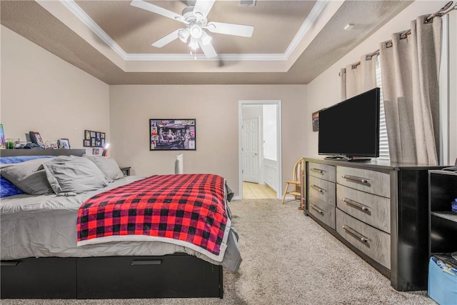 801 Camellia Ct, College Station, TX 77840 - bedroom with a tray ceiling, light colored carpet, ornamental molding, ensuite bathroom, and a ceiling fan