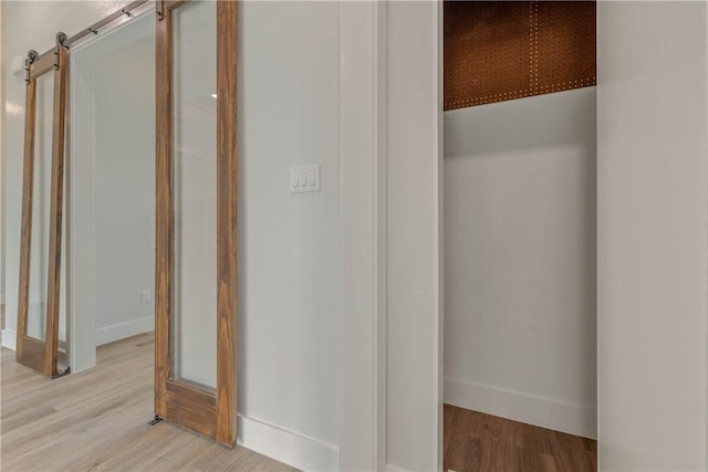 bathroom with hardwood / wood-style flooring