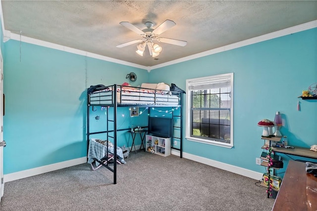 carpeted bedroom featuring ornamental molding, a textured ceiling, baseboards, and a ceiling fan