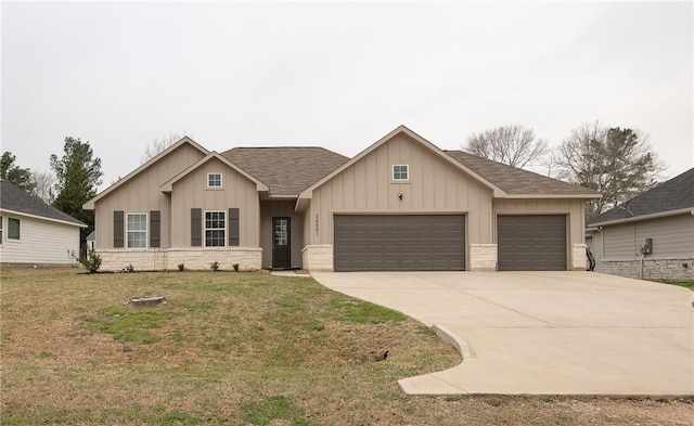 view of front of property featuring roof with shingles, concrete driveway, an attached garage, board and batten siding, and a front lawn