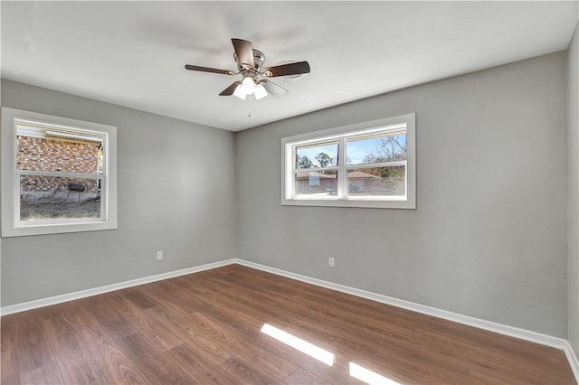 spare room featuring hardwood / wood-style flooring and ceiling fan