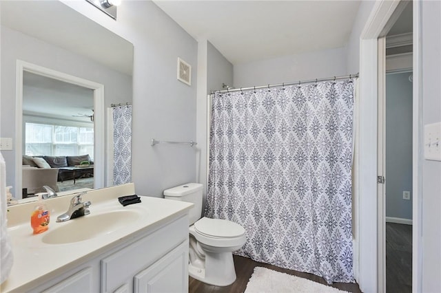 bathroom with toilet, a shower with shower curtain, wood finished floors, vanity, and visible vents