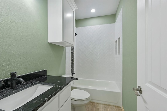 full bathroom with vanity, toilet, wood-type flooring, and bathtub / shower combination