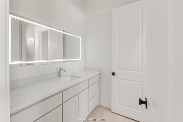 bathroom with tile patterned flooring and vanity