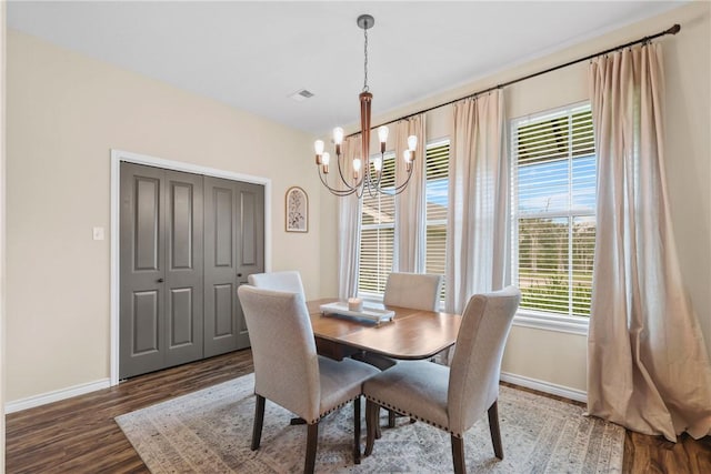 6866 Wooded Dr, College Station, TX 77845 - dining room with wood finished floors and a chandelier