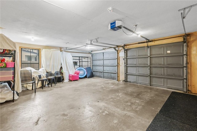6866 Wooded Dr, College Station, TX 77845 - garage featuring a garage door opener
