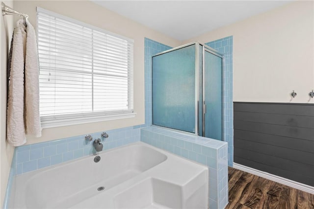 6866 Wooded Dr, College Station, TX 77845 - full bath featuring a garden tub, a stall shower, and wood finished floors