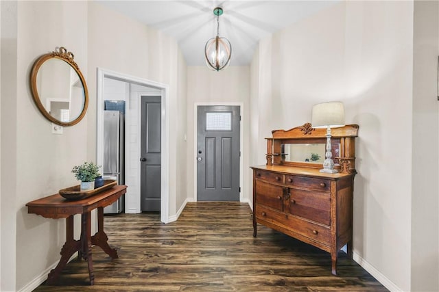 6866 Wooded Dr, College Station, TX 77845 - foyer with dark wood finished floors and a chandelier
