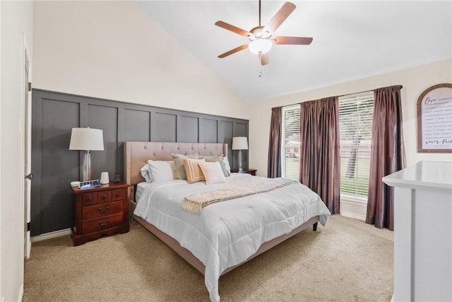 6866 Wooded Dr, College Station, TX 77845 - bedroom with light colored carpet, lofted ceiling, ceiling fan, and a decorative wall