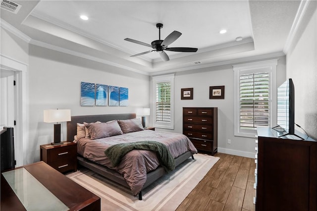 1909 Bareboot Trl, College Station, TX 77845 - bedroom with a raised ceiling, hardwood / wood-style floors, ornamental molding, recessed lighting, and ceiling fan