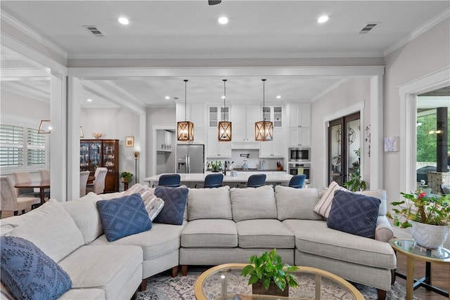 1909 Bareboot Trl, College Station, TX 77845 - living room featuring recessed lighting and crown molding