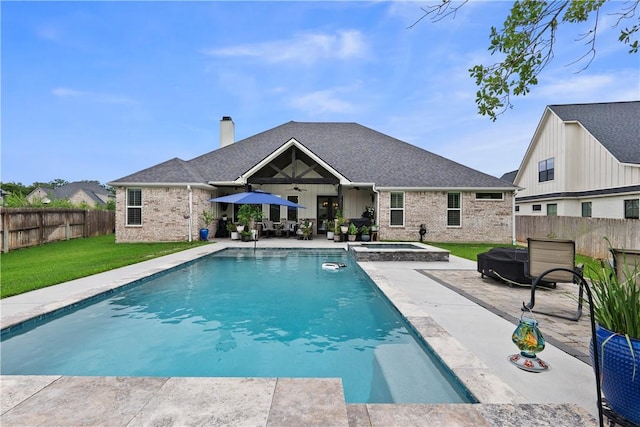 1909 Bareboot Trl, College Station, TX 77845 - view of pool with a patio, a fenced backyard, ceiling fan, and a pool with connected hot tub