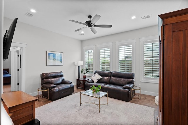 1909 Bareboot Trl, College Station, TX 77845 - living area with wood finished floors, a ceiling fan, and recessed lighting