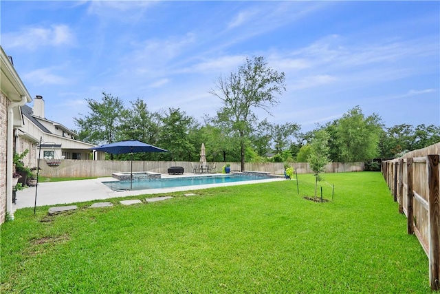 1909 Bareboot Trl, College Station, TX 77845 - fenced backyard featuring a pool with connected hot tub and a patio area