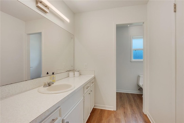 1003 Guadalupe Dr, College Station, TX 77840 - bathroom featuring wood finished floors and vanity