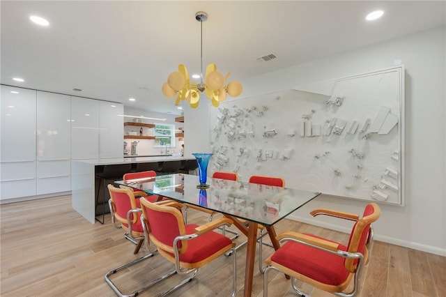 1003 Guadalupe Dr, College Station, TX 77840 - dining area featuring light wood-style flooring, a chandelier, and recessed lighting