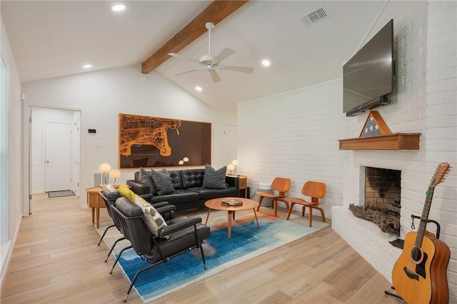 1003 Guadalupe Dr, College Station, TX 77840 - living area featuring a ceiling fan, light wood-type flooring, beam ceiling, a brick fireplace, and recessed lighting